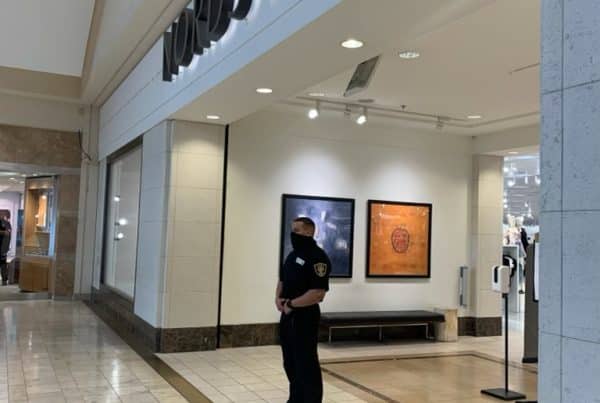 security guard in front of a nordstorm shopping center for loss and prevention