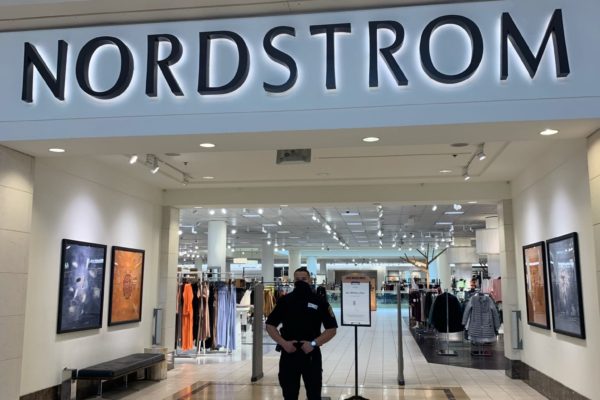 Front pic of a security guard guarding nordstrom