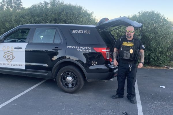 armed security guard in los angeles with patrol vehicle